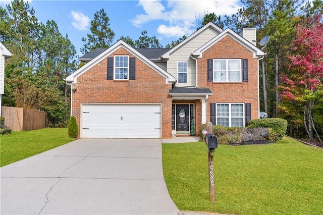 view of front of property featuring a garage and a front lawn