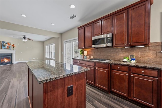 29 Lankford Rd, Tucker, GA 30084 - kitchen with dark wood-style flooring, stainless steel appliances, a ceiling fan, backsplash, and recessed lighting