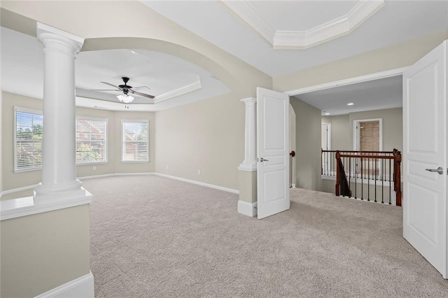 29 Lankford Rd, Tucker, GA 30084 - carpeted empty room with a raised ceiling, a ceiling fan, decorative columns, ornamental molding, and baseboards