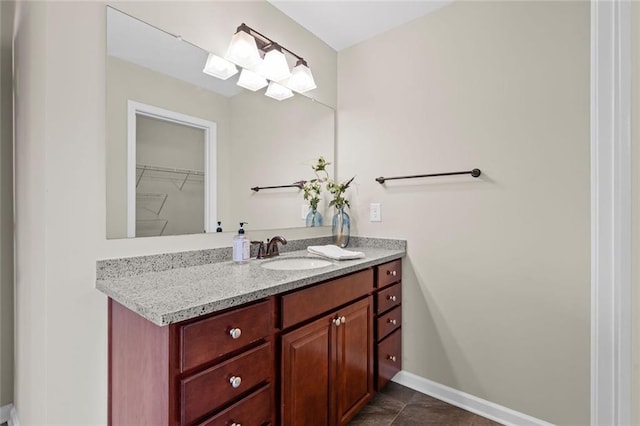 29 Lankford Rd, Tucker, GA 30084 - bathroom featuring vanity, baseboards, and a spacious closet