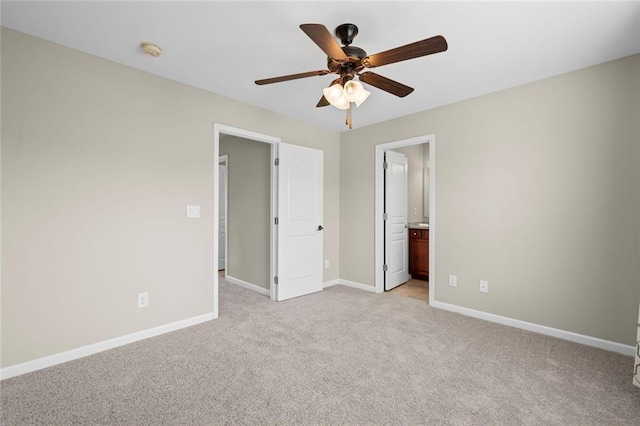 29 Lankford Rd, Tucker, GA 30084 - unfurnished bedroom with light colored carpet, baseboards, connected bathroom, and ceiling fan