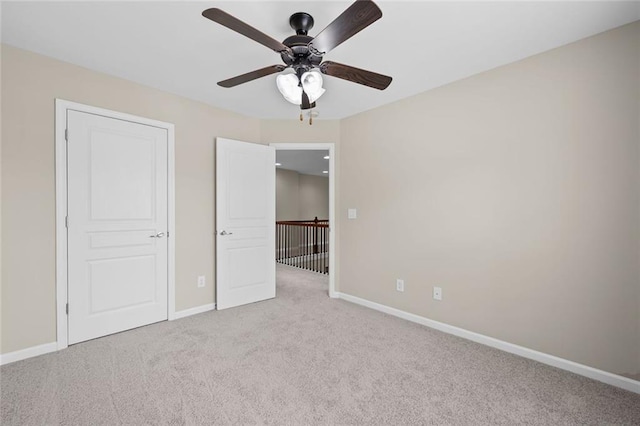 29 Lankford Rd, Tucker, GA 30084 - unfurnished bedroom featuring light carpet, baseboards, and a ceiling fan