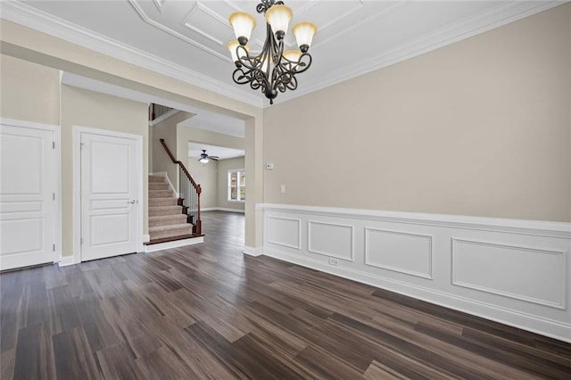 29 Lankford Rd, Tucker, GA 30084 - spare room with a chandelier, stairs, dark wood-style floors, crown molding, and ceiling fan