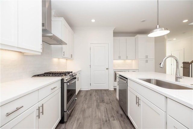711 Dodd Ln N Unit 166, Buford, GA 30518 - kitchen with stainless steel appliances, wall chimney exhaust hood, a sink, decorative backsplash, and white cabinets
