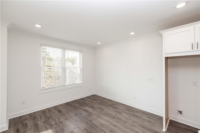 711 Dodd Ln N Unit 166, Buford, GA 30518 - unfurnished bedroom with crown molding, dark wood-style floors, recessed lighting, and baseboards