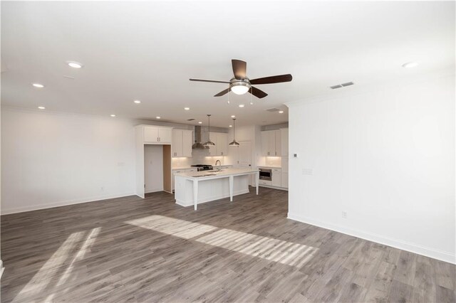 711 Dodd Ln N Unit 166, Buford, GA 30518 - unfurnished living room with a ceiling fan, baseboards, light wood-style flooring, recessed lighting, and ornamental molding