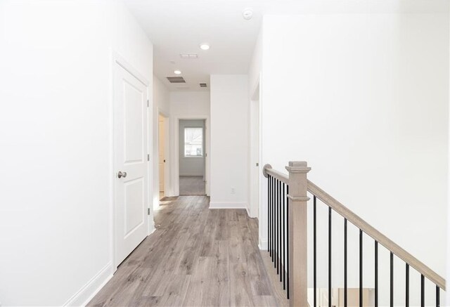 711 Dodd Ln N Unit 166, Buford, GA 30518 - corridor with an upstairs landing, light wood-style floors, baseboards, and recessed lighting