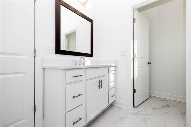 711 Dodd Ln N Unit 166, Buford, GA 30518 - bathroom featuring baseboards, vanity, and marble finish floors