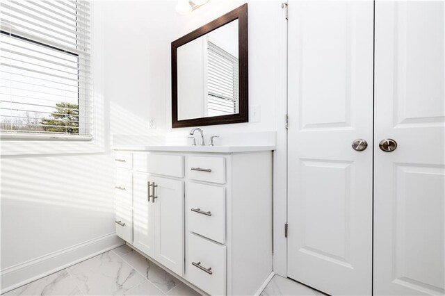 711 Dodd Ln N Unit 166, Buford, GA 30518 - bathroom with marble finish floors, baseboards, and vanity