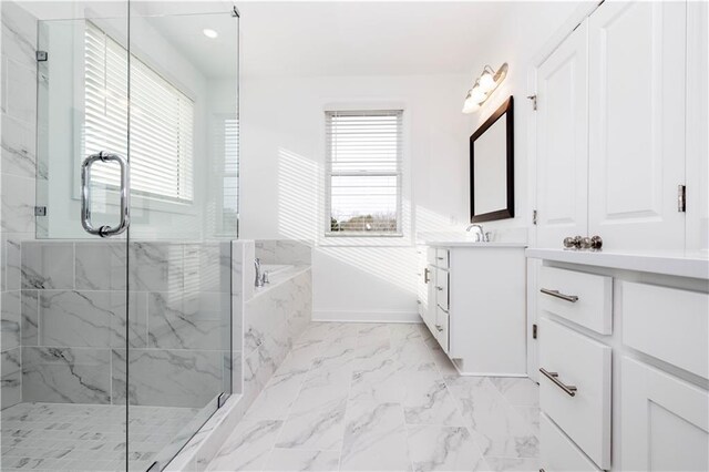711 Dodd Ln N Unit 166, Buford, GA 30518 - bathroom featuring plenty of natural light, a marble finish shower, vanity, marble finish floors, and recessed lighting