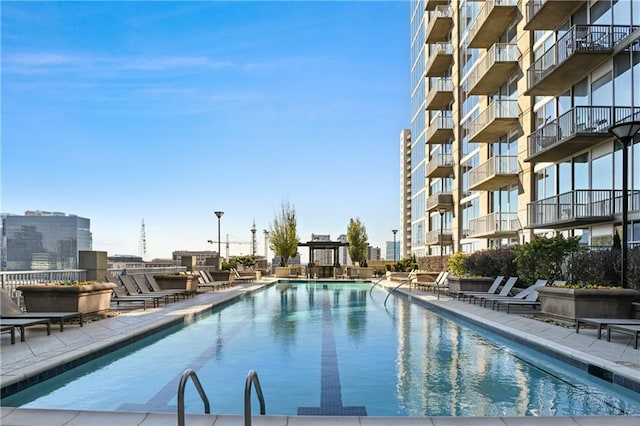 view of swimming pool with a patio