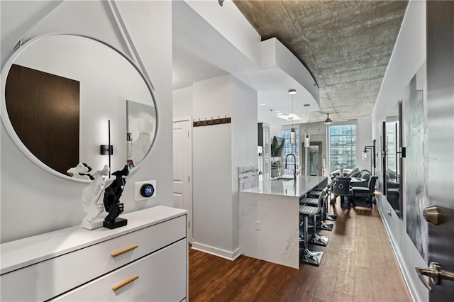 interior space featuring ceiling fan and dark hardwood / wood-style flooring