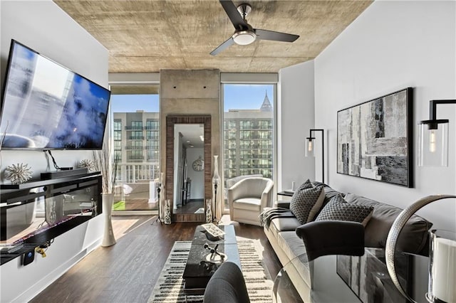 living room featuring dark hardwood / wood-style floors and ceiling fan