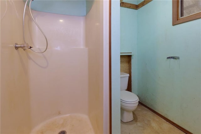 bathroom with toilet and walk in shower