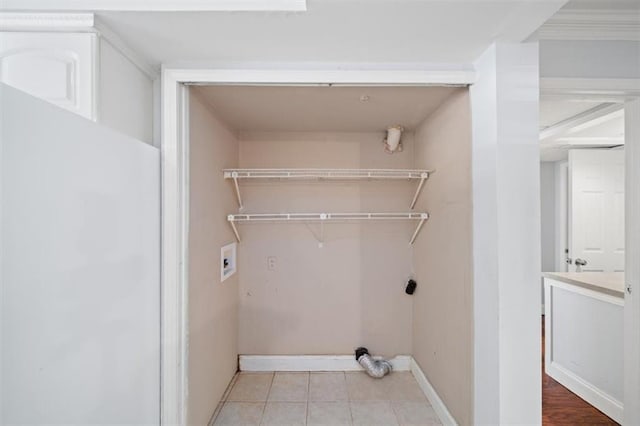 laundry room with washer hookup and light tile patterned floors