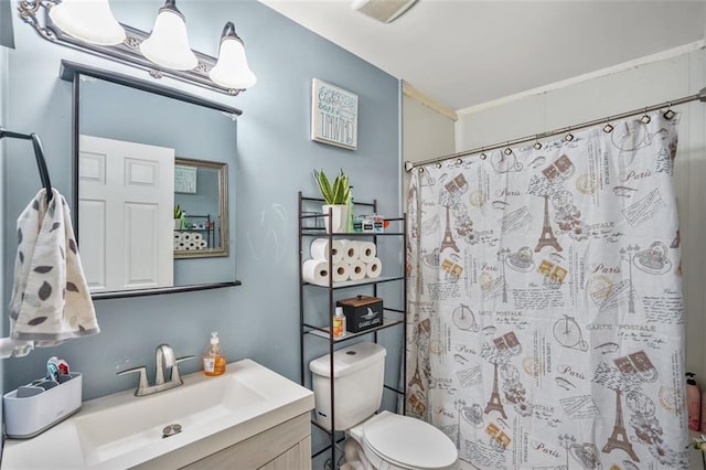 bathroom with vanity, toilet, a shower with curtain, and visible vents