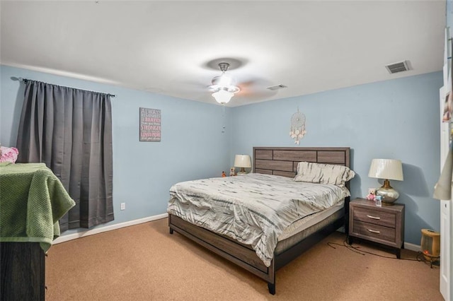 carpeted bedroom with visible vents and baseboards