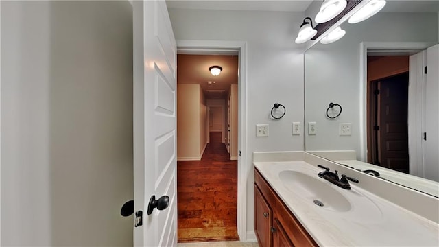 bathroom featuring hardwood / wood-style flooring and vanity