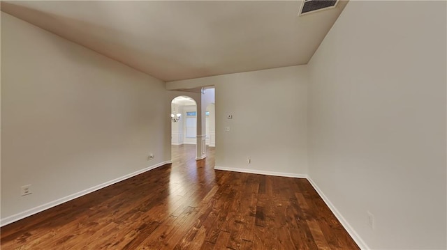 empty room featuring dark wood-type flooring