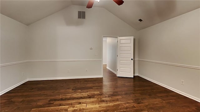 spare room with dark wood-type flooring, ceiling fan, and vaulted ceiling