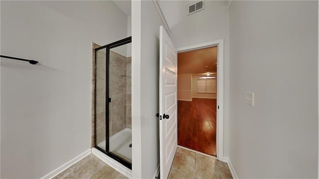 bathroom featuring tile patterned floors and walk in shower