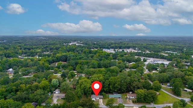 drone / aerial view featuring a view of trees