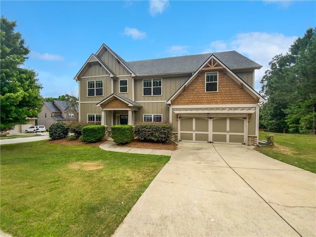 craftsman house featuring a front lawn and a garage