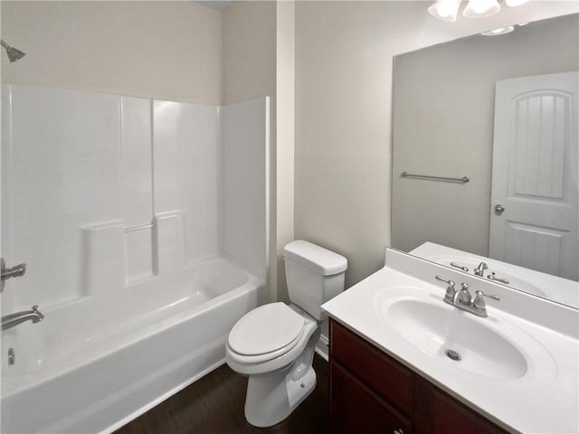 full bathroom with shower / tub combination, vanity, toilet, and hardwood / wood-style floors