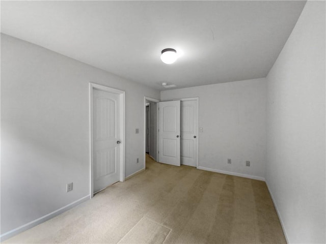 unfurnished bedroom with light carpet