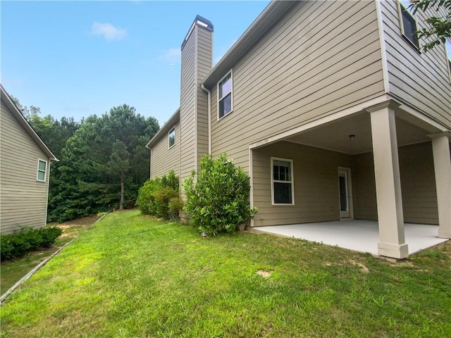 exterior space featuring a yard and a patio