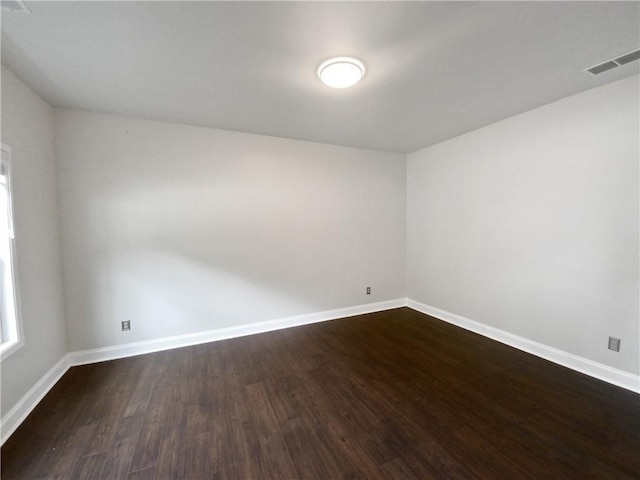 unfurnished room with hardwood / wood-style floors