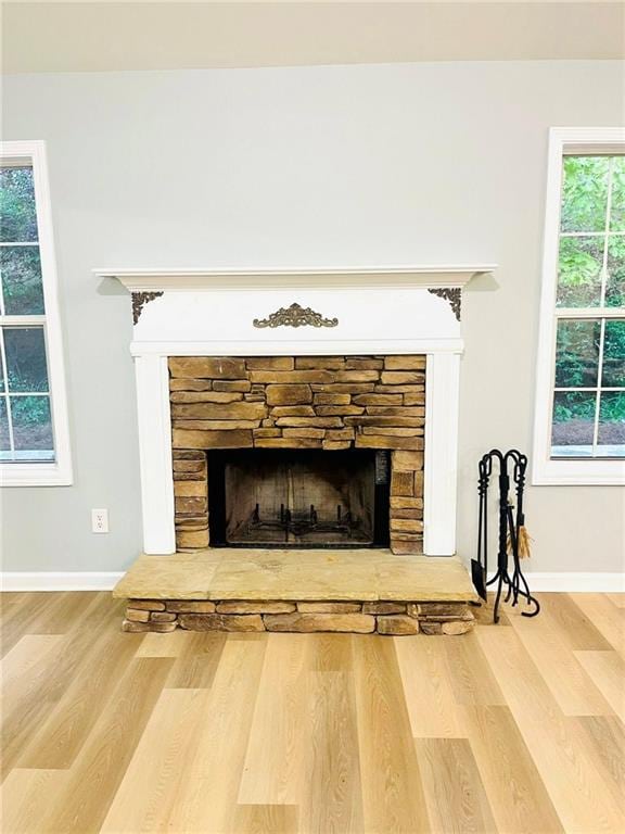 7675 Lanier View Rdg, Cumming, GA 30041 - detailed view of a fireplace, wood finished floors, and baseboards