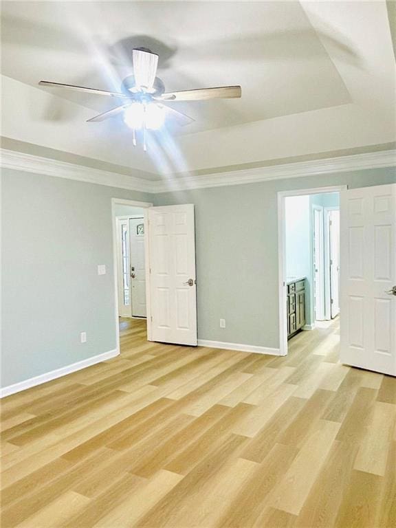 7675 Lanier View Rdg, Cumming, GA 30041 - spare room with baseboards, light wood finished floors, a ceiling fan, and ornamental molding