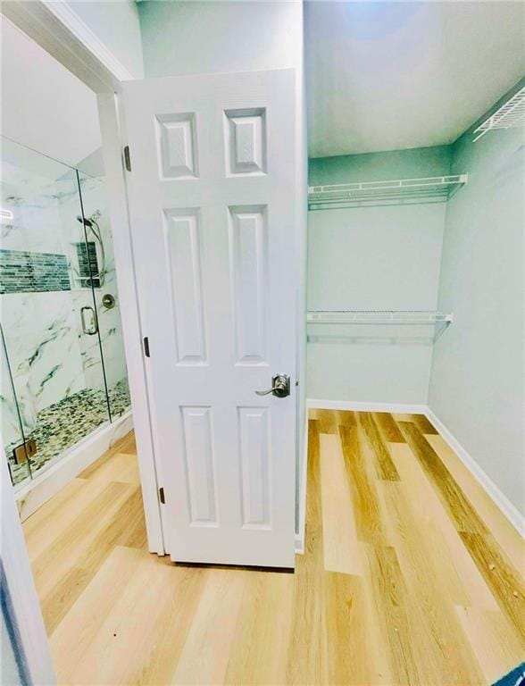 7675 Lanier View Rdg, Cumming, GA 30041 - walk in closet with wood finished floors
