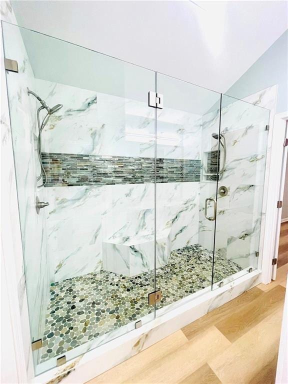 7675 Lanier View Rdg, Cumming, GA 30041 - full bath featuring a marble finish shower and wood finished floors