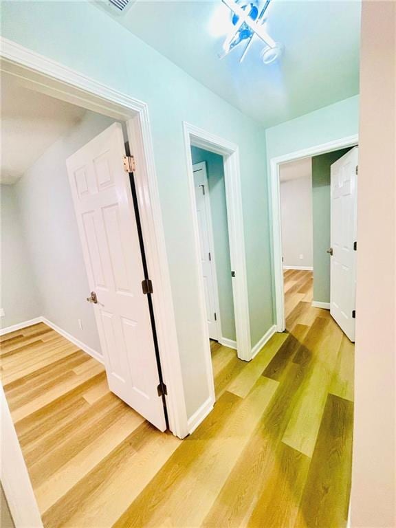 7675 Lanier View Rdg, Cumming, GA 30041 - hallway with wood finished floors and baseboards
