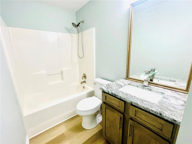 7675 Lanier View Rdg, Cumming, GA 30041 - full bath with wood finished floors, toilet, vanity, and shower / washtub combination