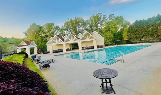 7675 Lanier View Rdg, Cumming, GA 30041 - community pool with a patio area and view of wooded area