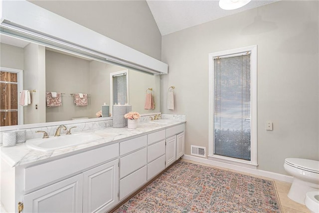 bathroom with tile patterned flooring, visible vents, a sink, and toilet