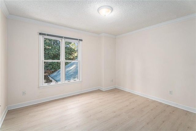 unfurnished room with light wood-style flooring, a textured ceiling, ornamental molding, and baseboards