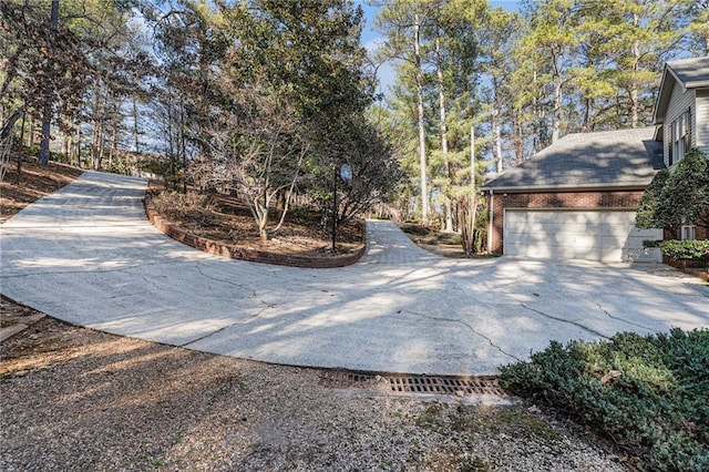 exterior space featuring concrete driveway