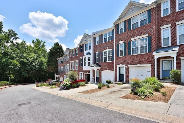 townhome / multi-family property featuring a garage