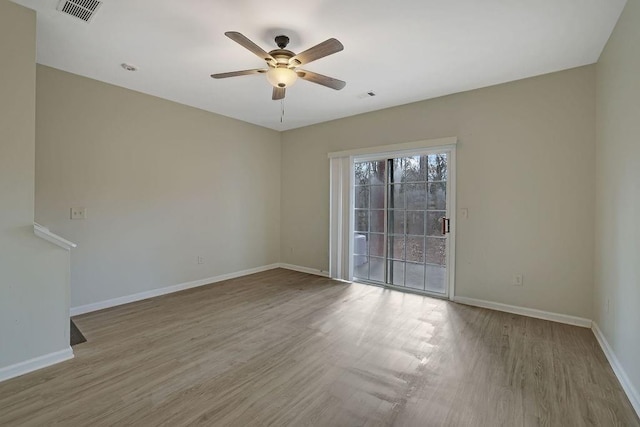 empty room with light hardwood / wood-style floors and ceiling fan