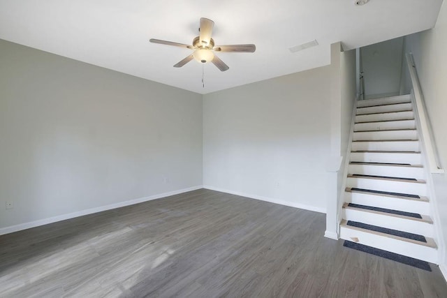 empty room featuring dark hardwood / wood-style floors and ceiling fan