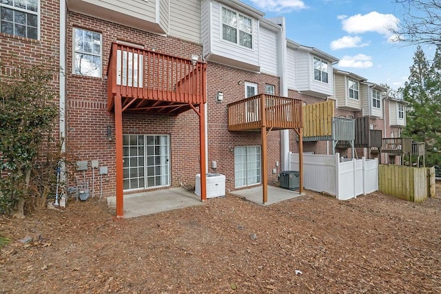 back of property featuring a patio and central air condition unit