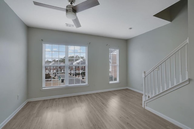 unfurnished room featuring ceiling fan and light hardwood / wood-style flooring