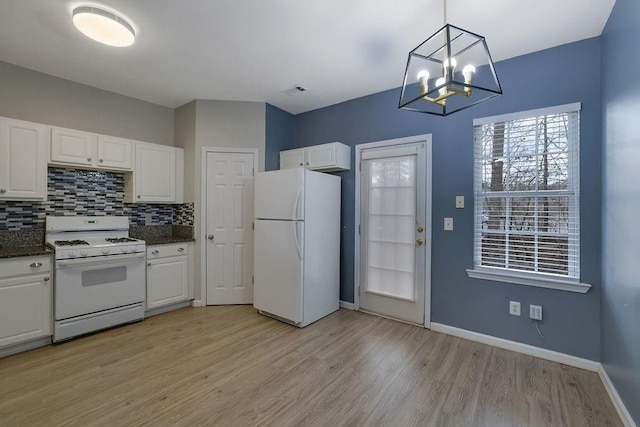 kitchen with backsplash, white cabinets, white appliances, and decorative light fixtures