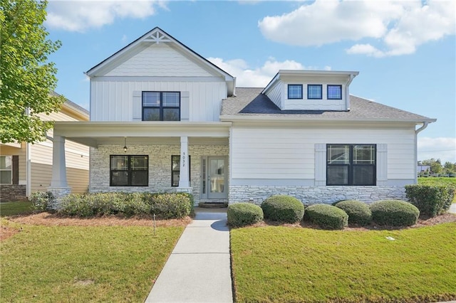 view of front of house featuring a front yard and covered porch