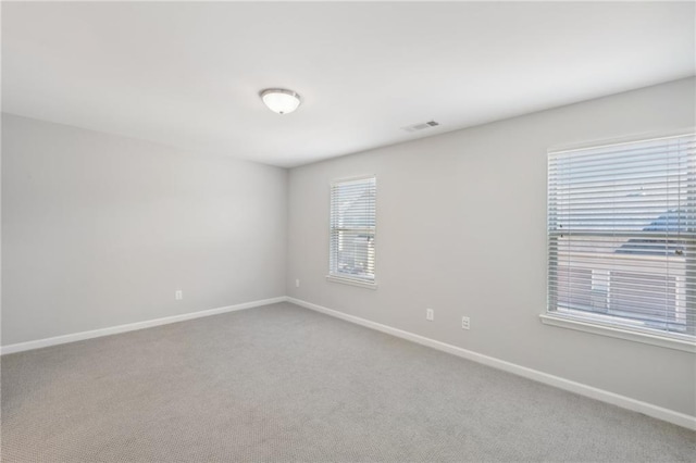 empty room with carpet flooring