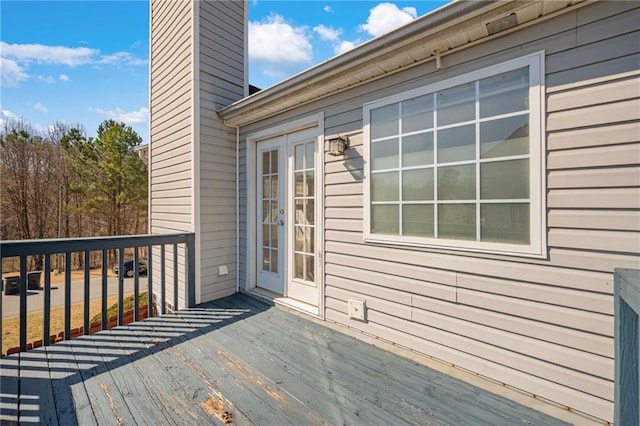 wooden terrace featuring french doors